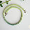 Long Green Fade Kumihimo necklace featuring hand-braided glass seed beads in a soft green gradient with a brass toggle clasp